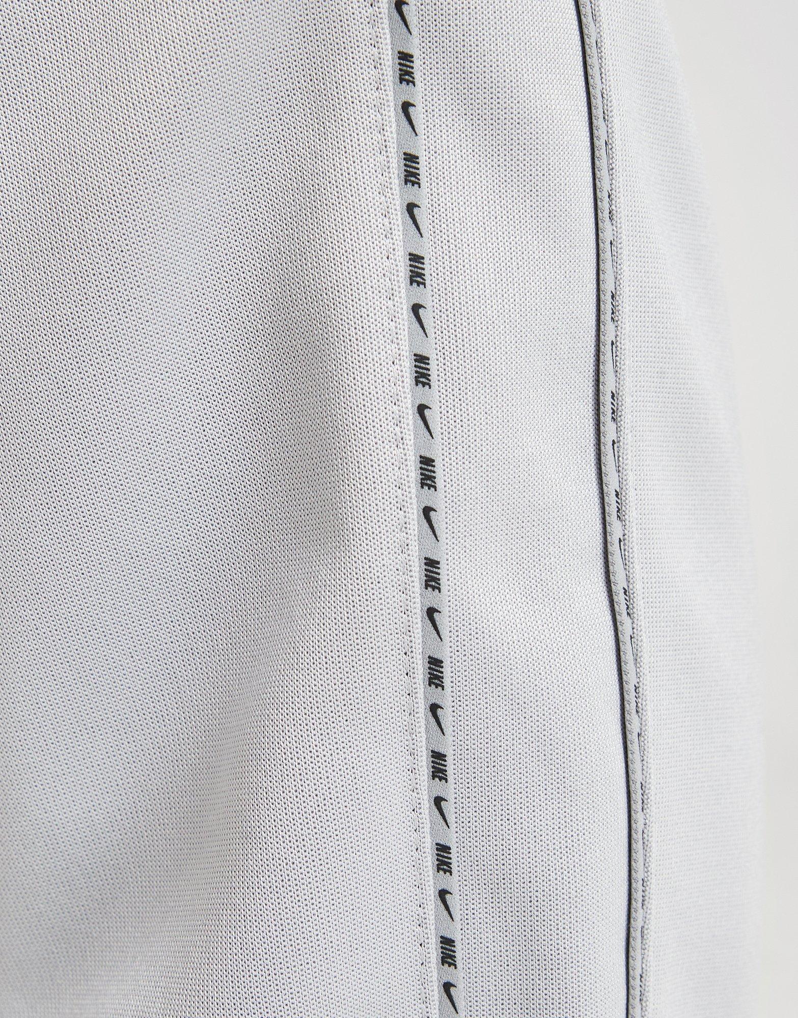 nike taped poly track pants