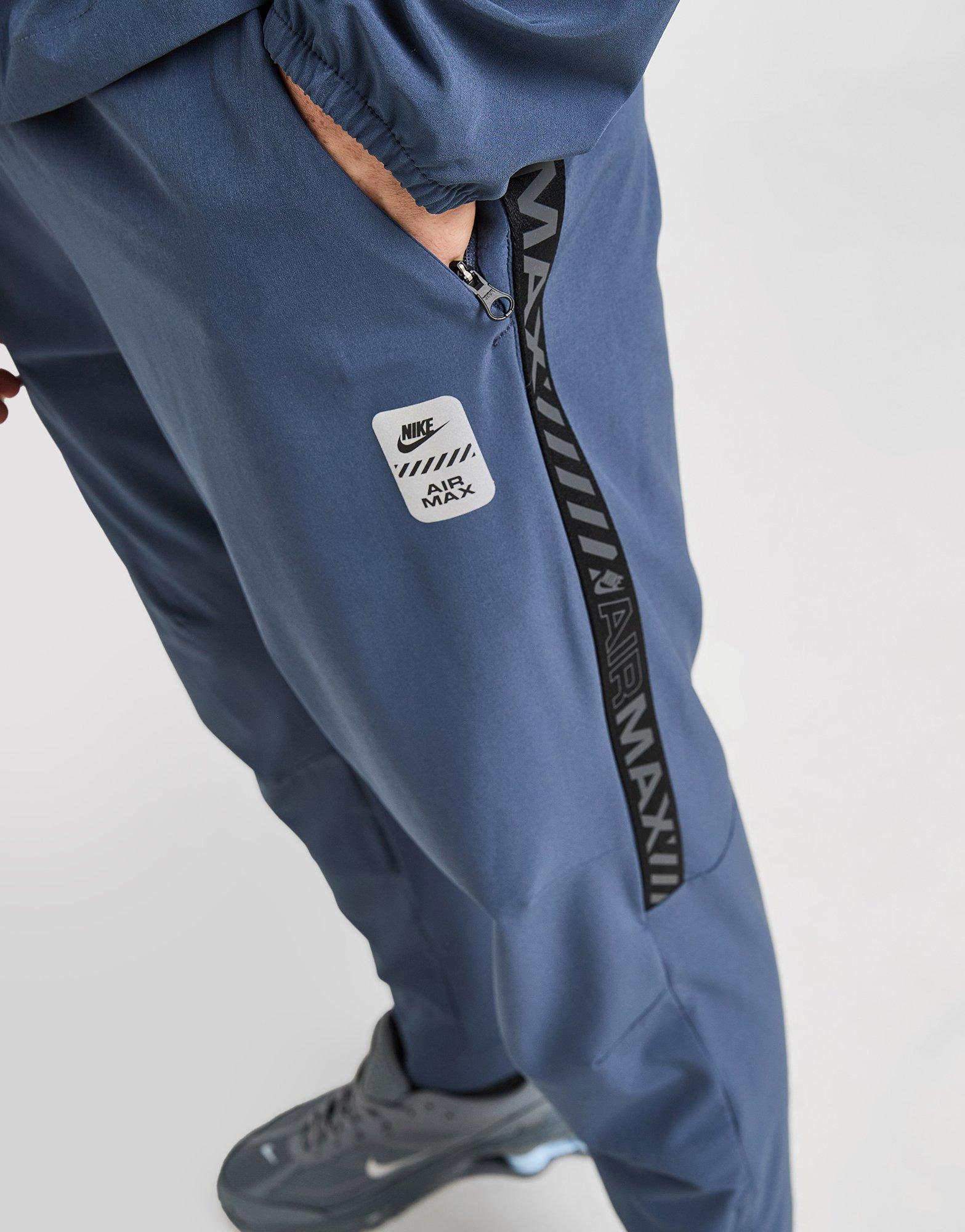 mens nike tape track pants
