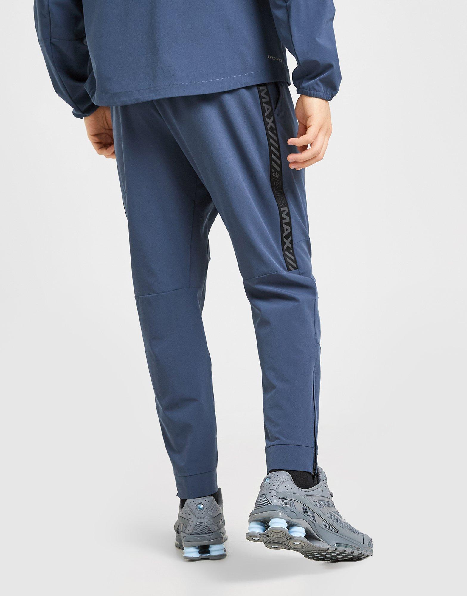 mens nike tape track pants
