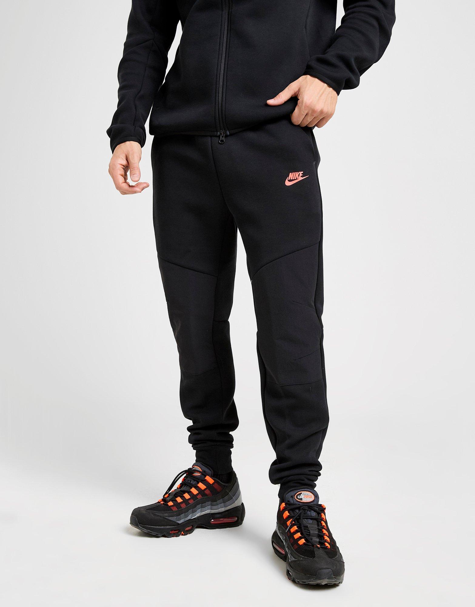 black nike joggers red logo
