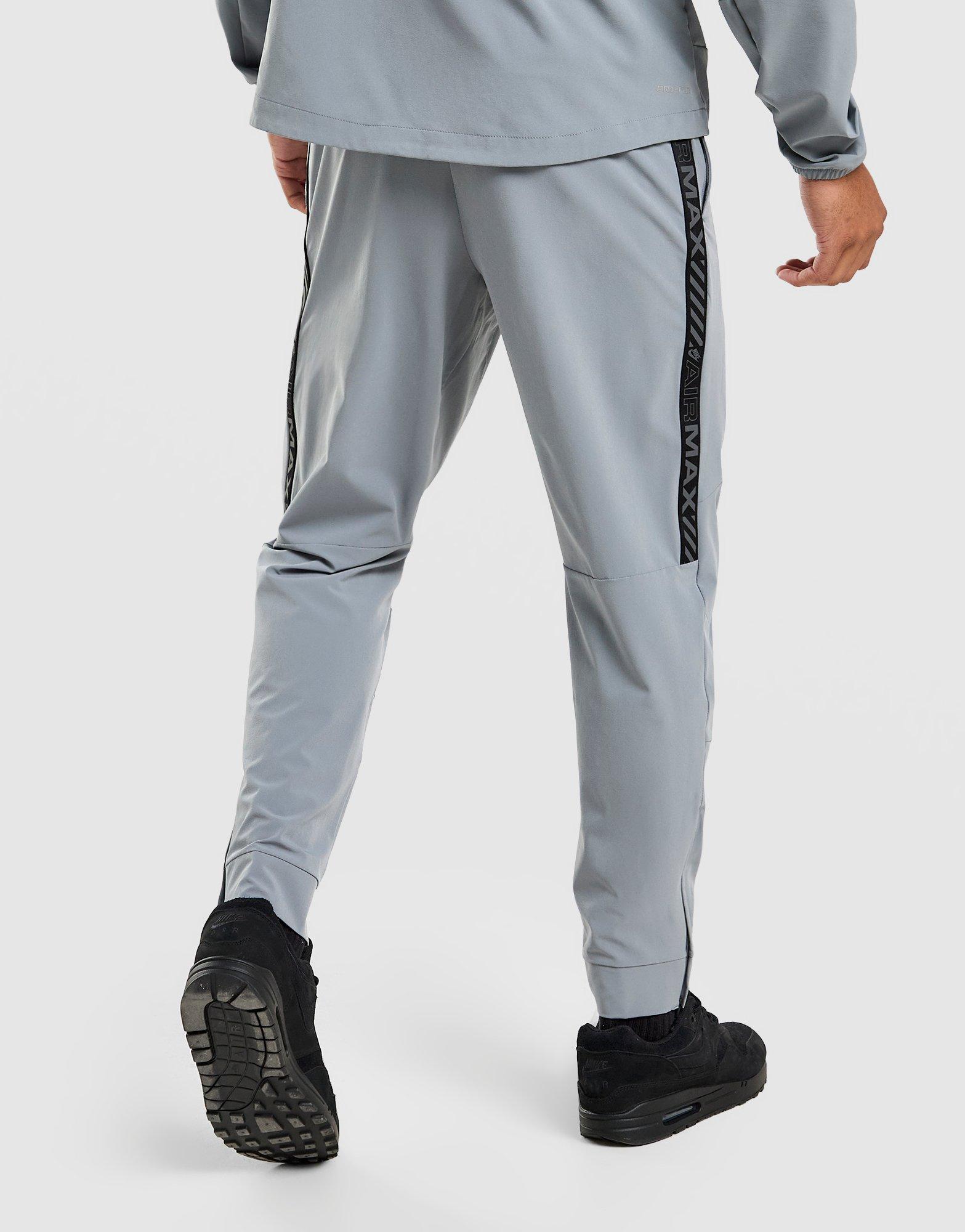 nike tape track pants grey