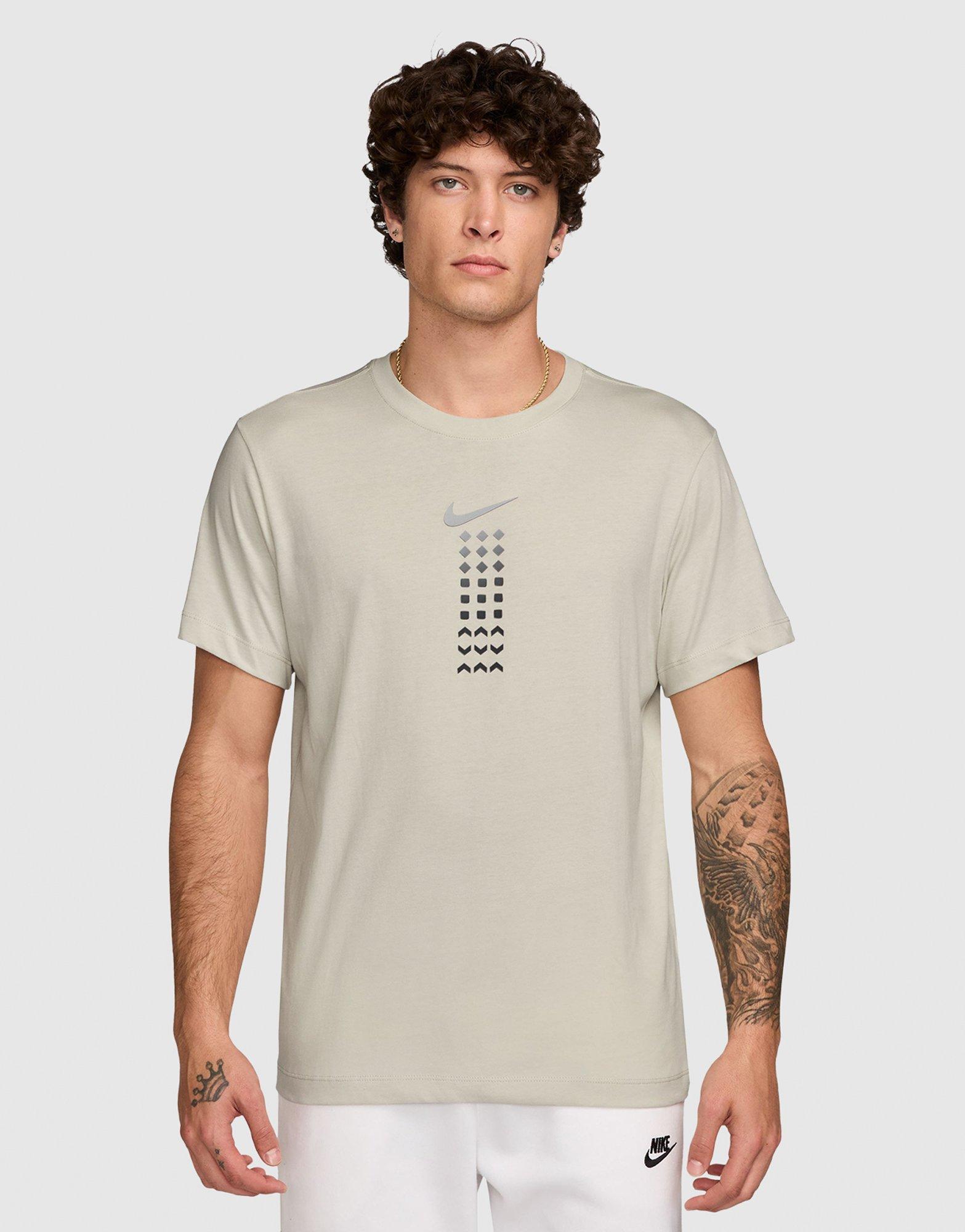 white and brown nike shirt